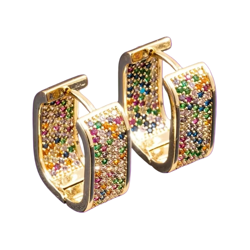 Gold hoop earrings with multicolored gemstones on a purple background