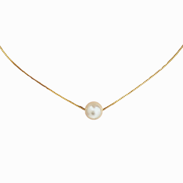 Gold necklace with a single pearl pendant on a white background
