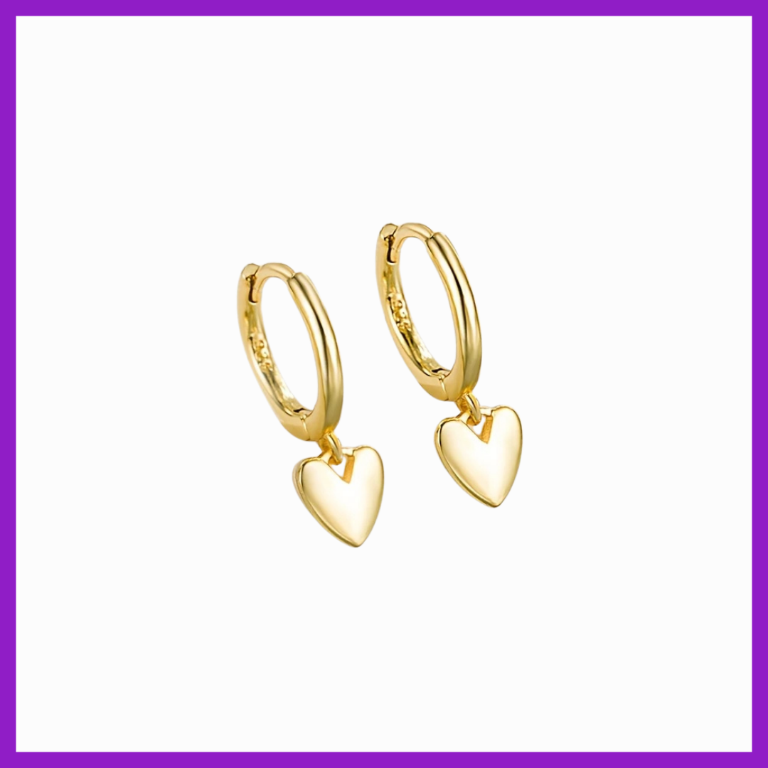 Gold heart-shaped hoop earrings on a white background