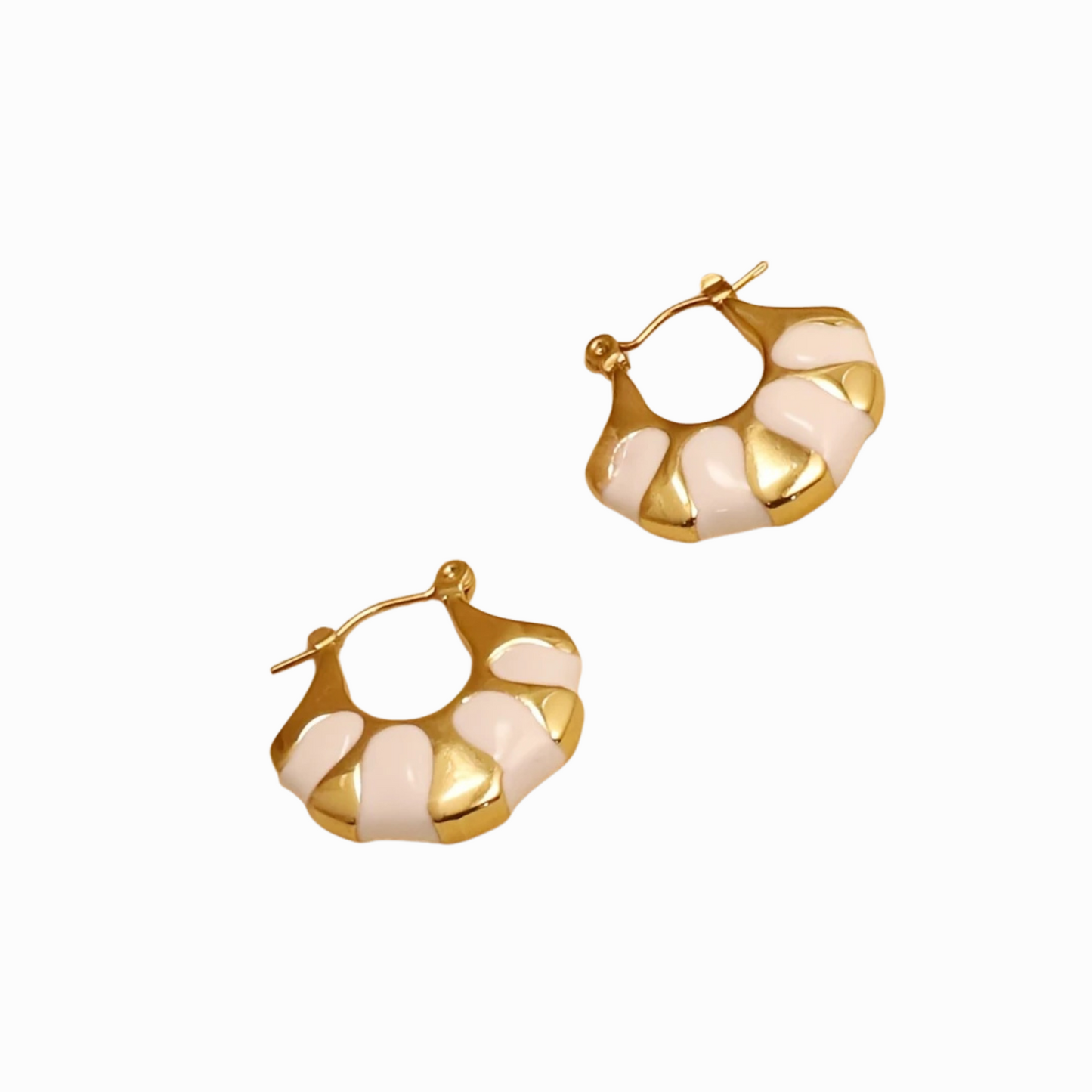 Gold and beige hoop earrings on a white background