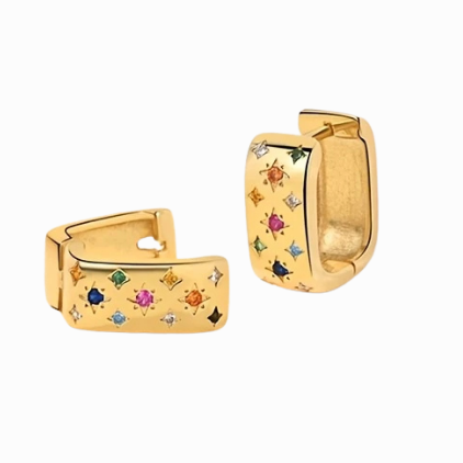 Gold hoop earrings with colorful gemstones on a white background