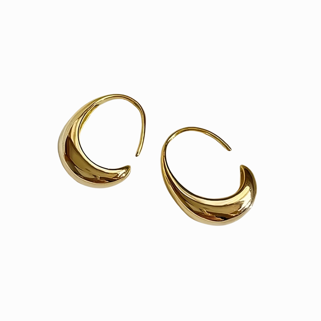 Gold hoop earrings on a white background
