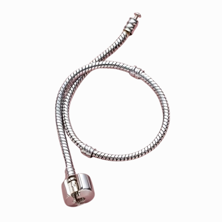Metallic spiral cable on a white background with a pink border