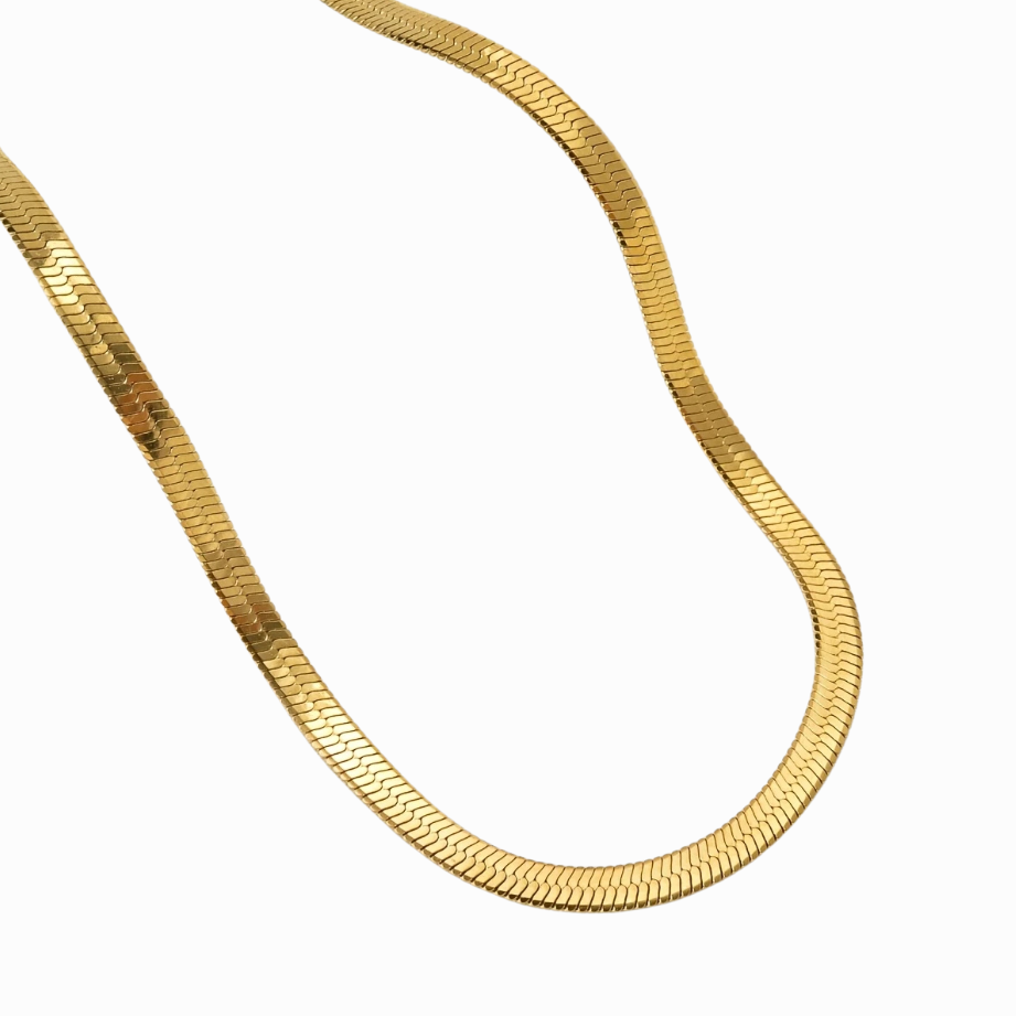Gold chain necklace on a white background