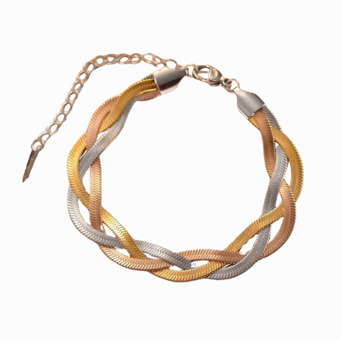 Bracelet with intertwined gold and silver strands on a white background