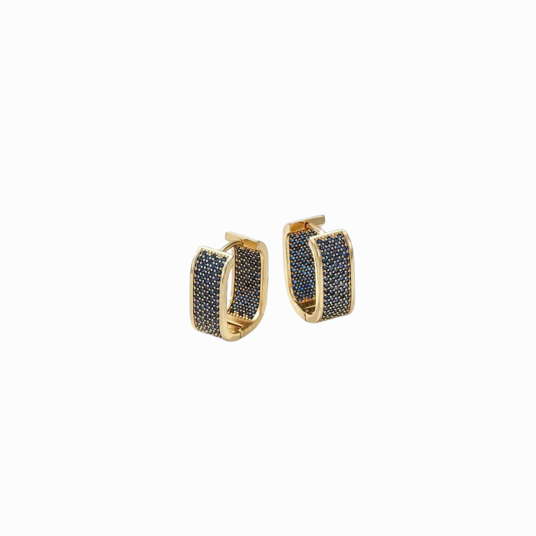Gold hoop earrings with black stones on a white background