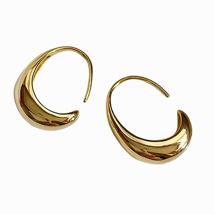 Gold hoop earrings on a white background