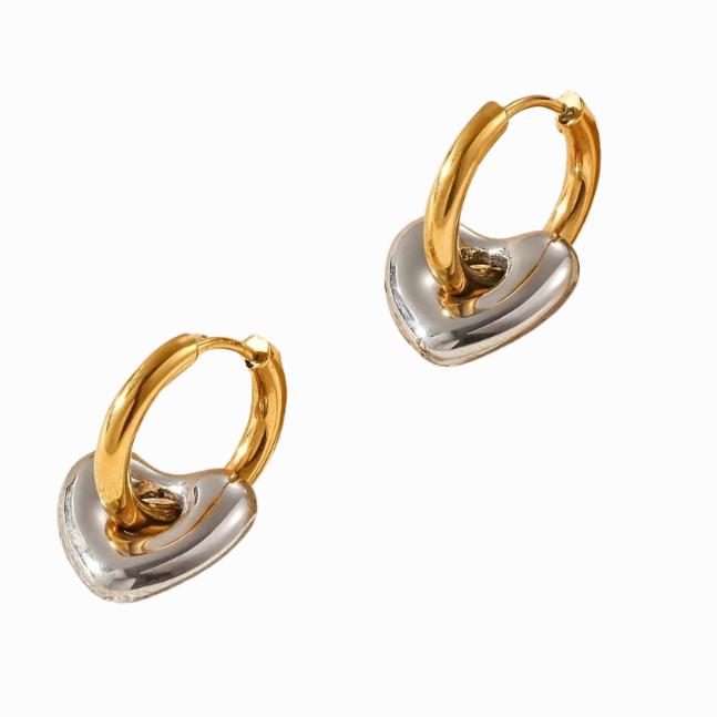 Pair of gold and silver hoop earrings on a white background