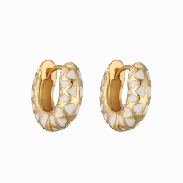 Gold hoop earrings with white pattern on a white background