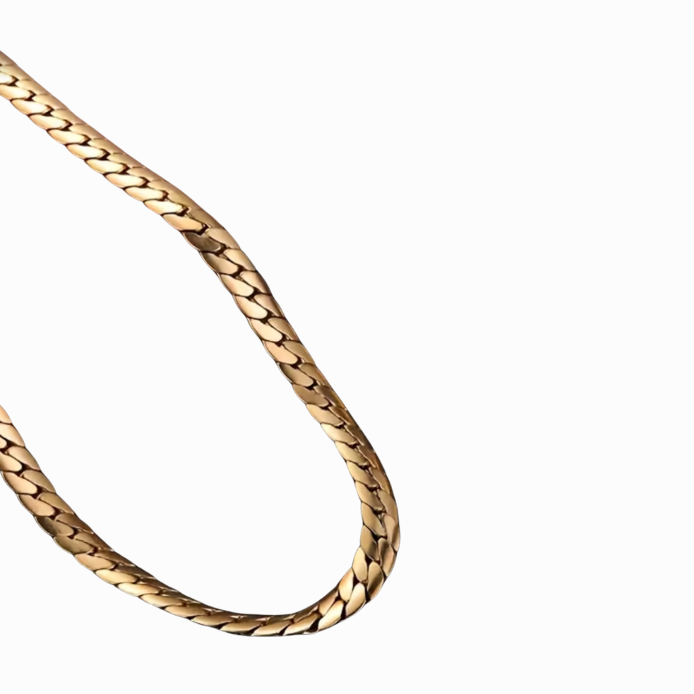 Gold chain necklace on a white background