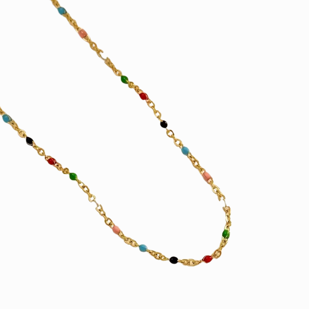 Gold chain necklace with colorful beads on a white background