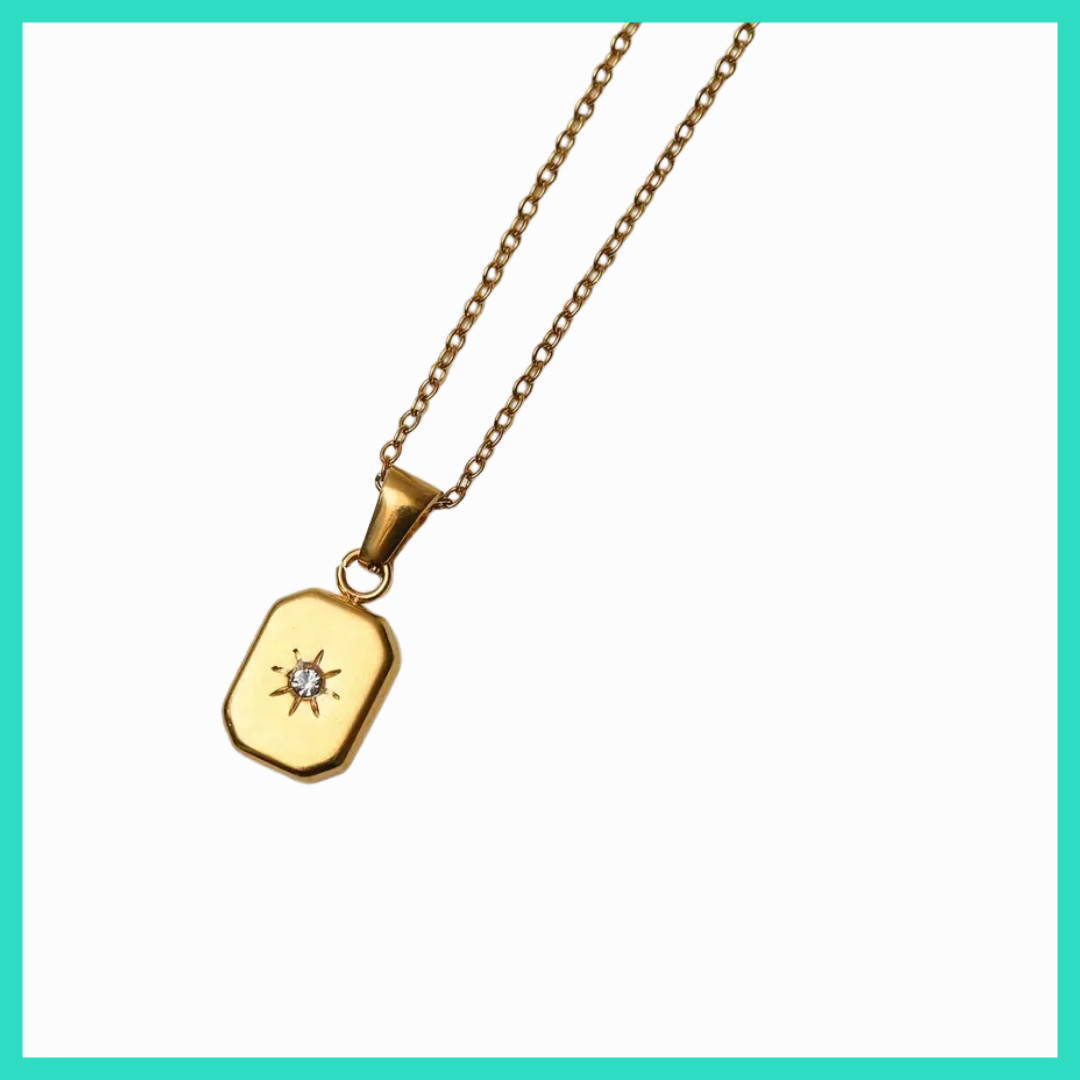 Gold necklace with a pendant on a white background