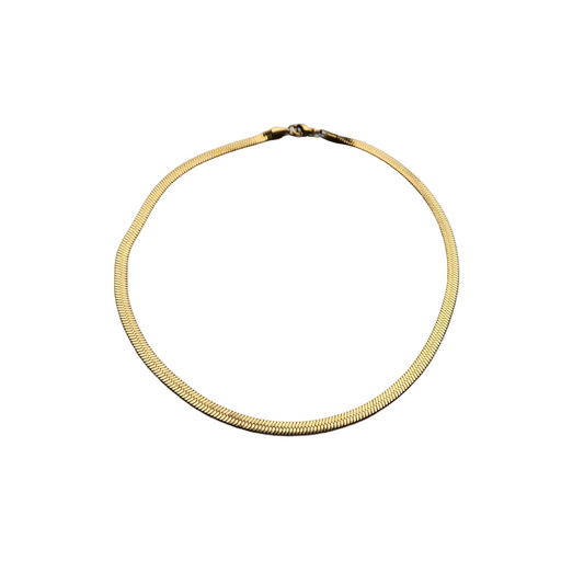 Gold necklace on a white background