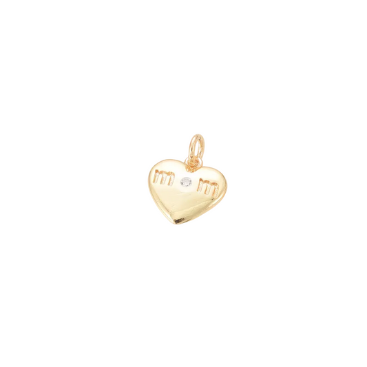 Gold heart-shaped pendant with engraved initials on a white background