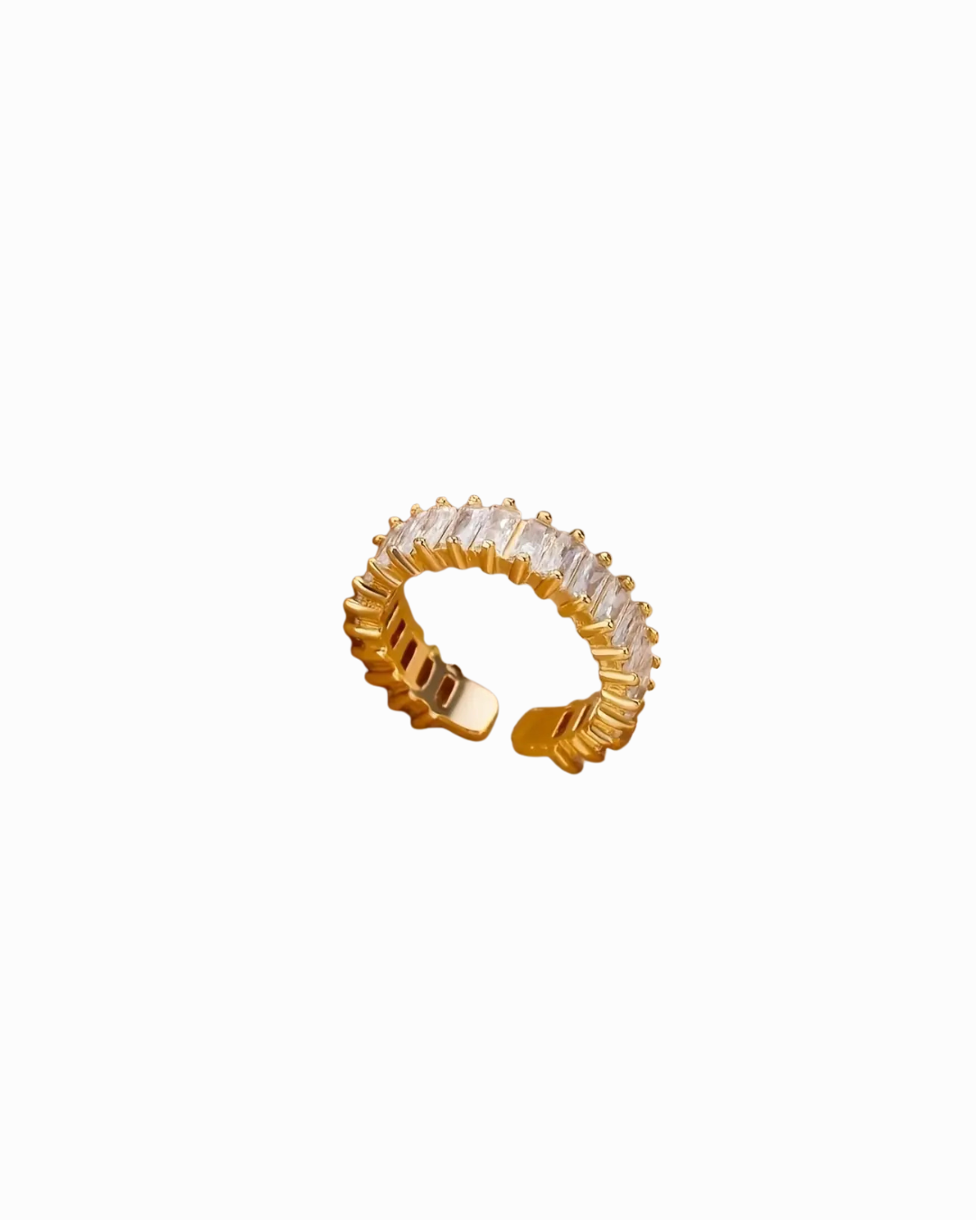 Gold ring with clear gemstones on a white background
