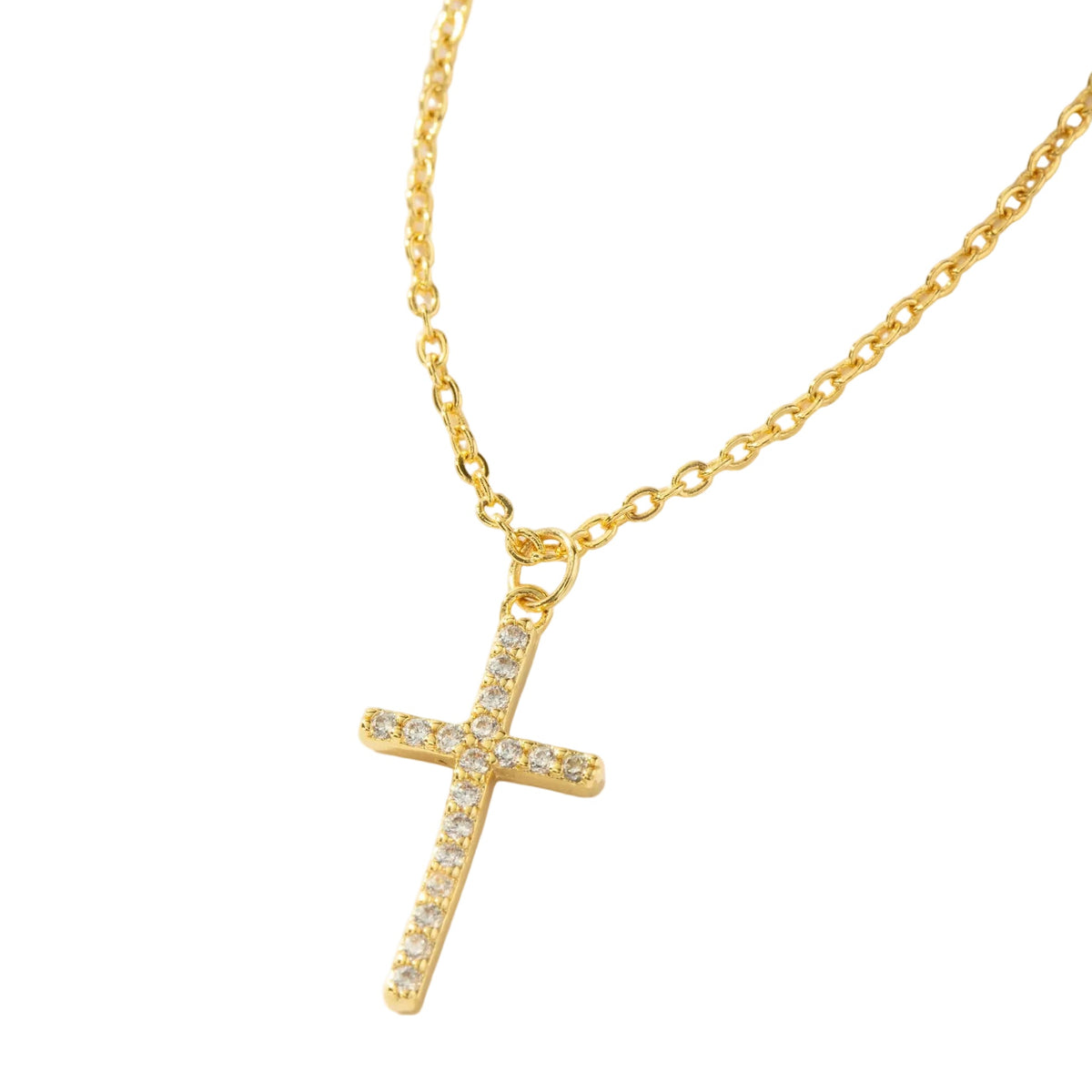 A gold cross pendant necklace adorned with small clear stones, hanging from a delicate gold chain against a clean white background.