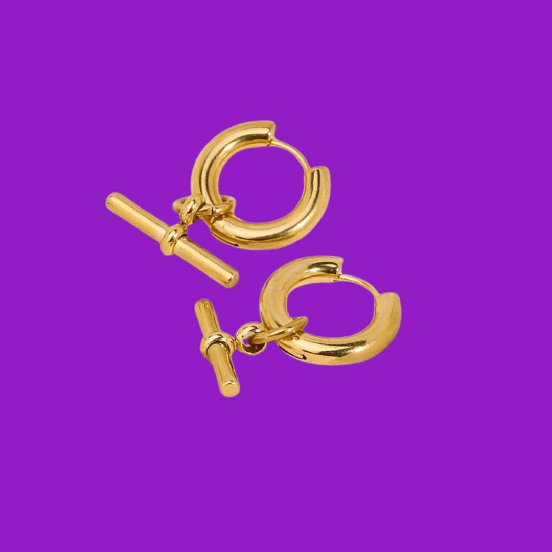 Gold hoop earrings with a clasp design on a purple background