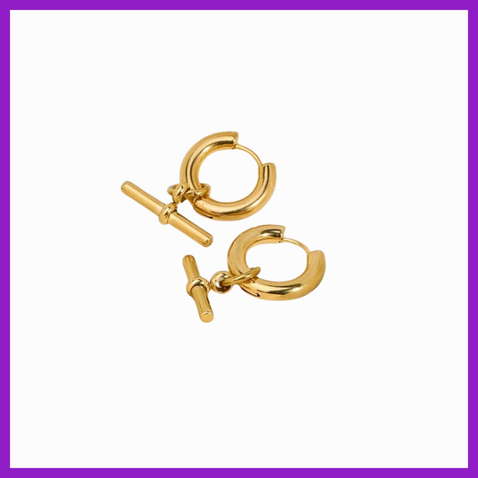 Pair of gold hoop earrings with a toggle clasp on a white background