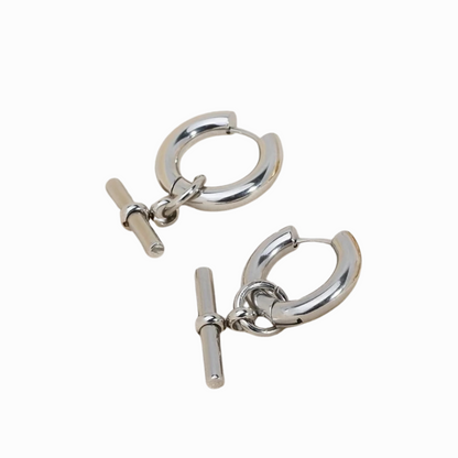 Pair of silver hoop earrings with a bar clasp on a white background