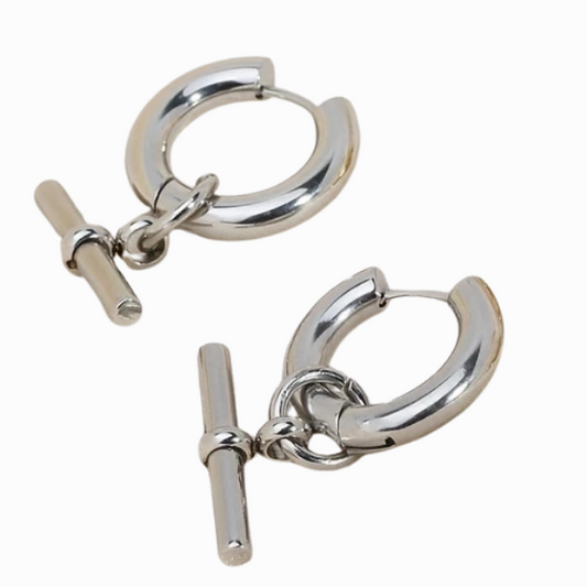 Pair of silver hoop earrings with a clasp on a white background