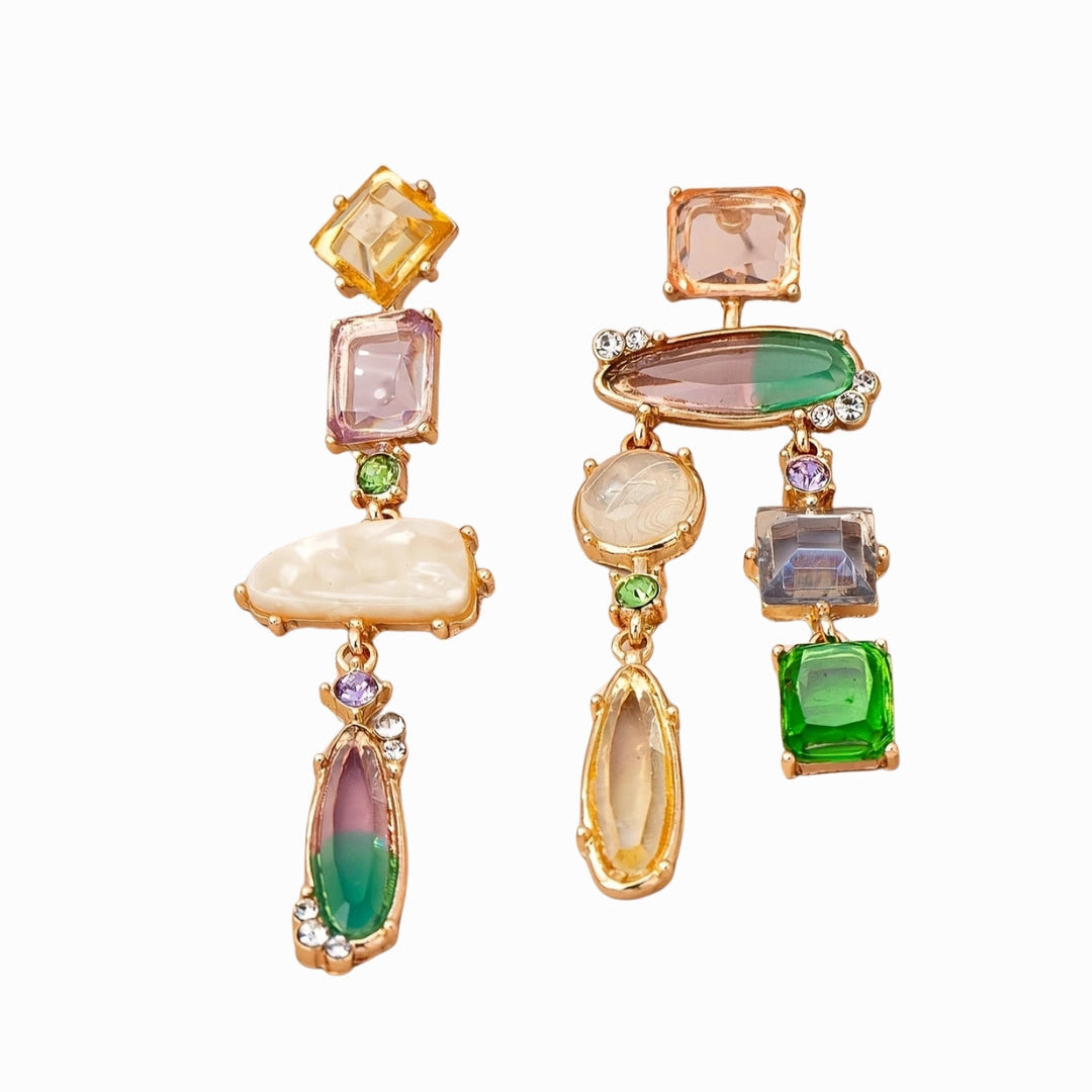 Multicolored gemstone earrings with gold accents on a white background