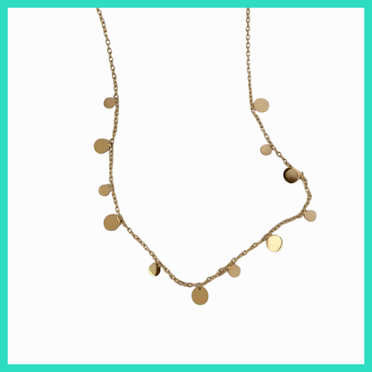 Gold necklace with round pendants on a white background