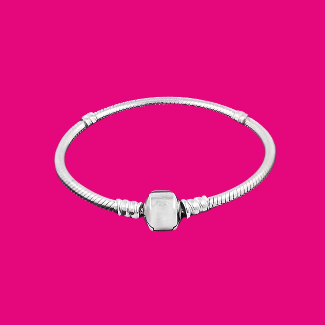 Silver bracelet with a hexagonal clasp on a pink background