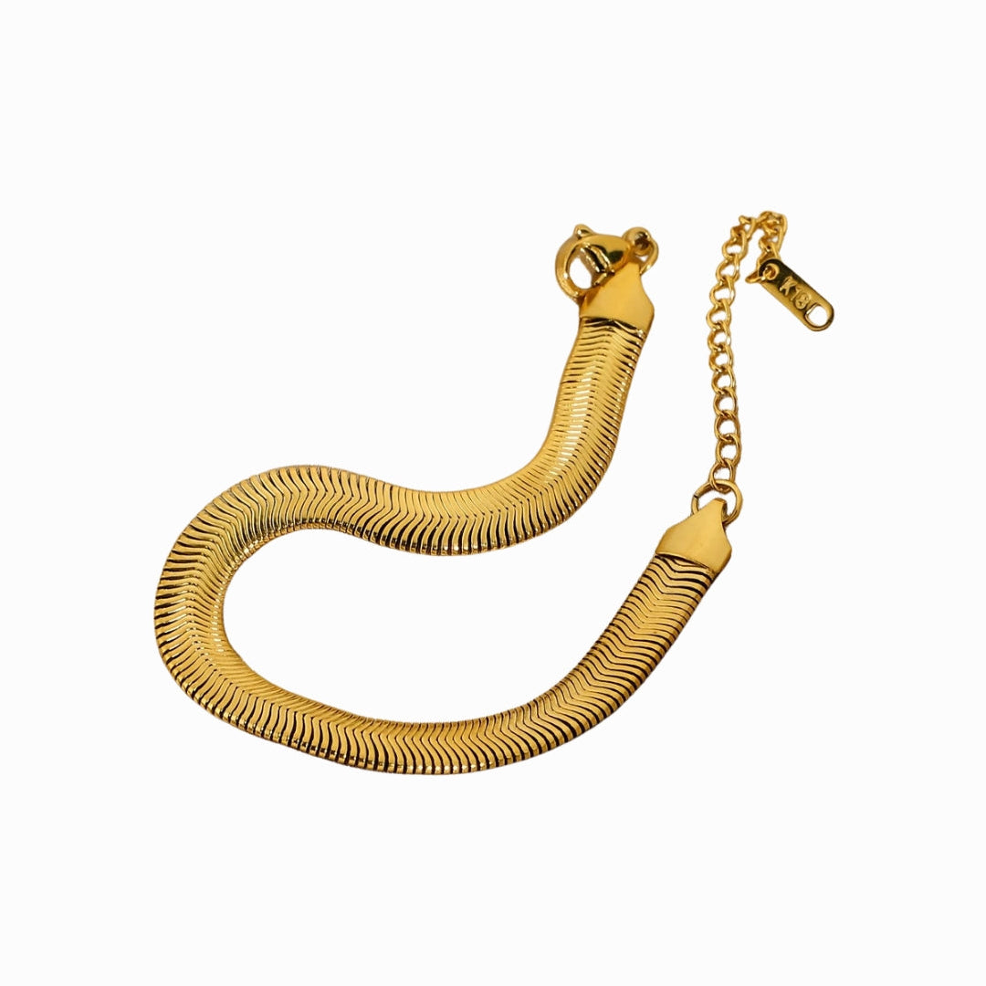 Gold bracelet on a white background