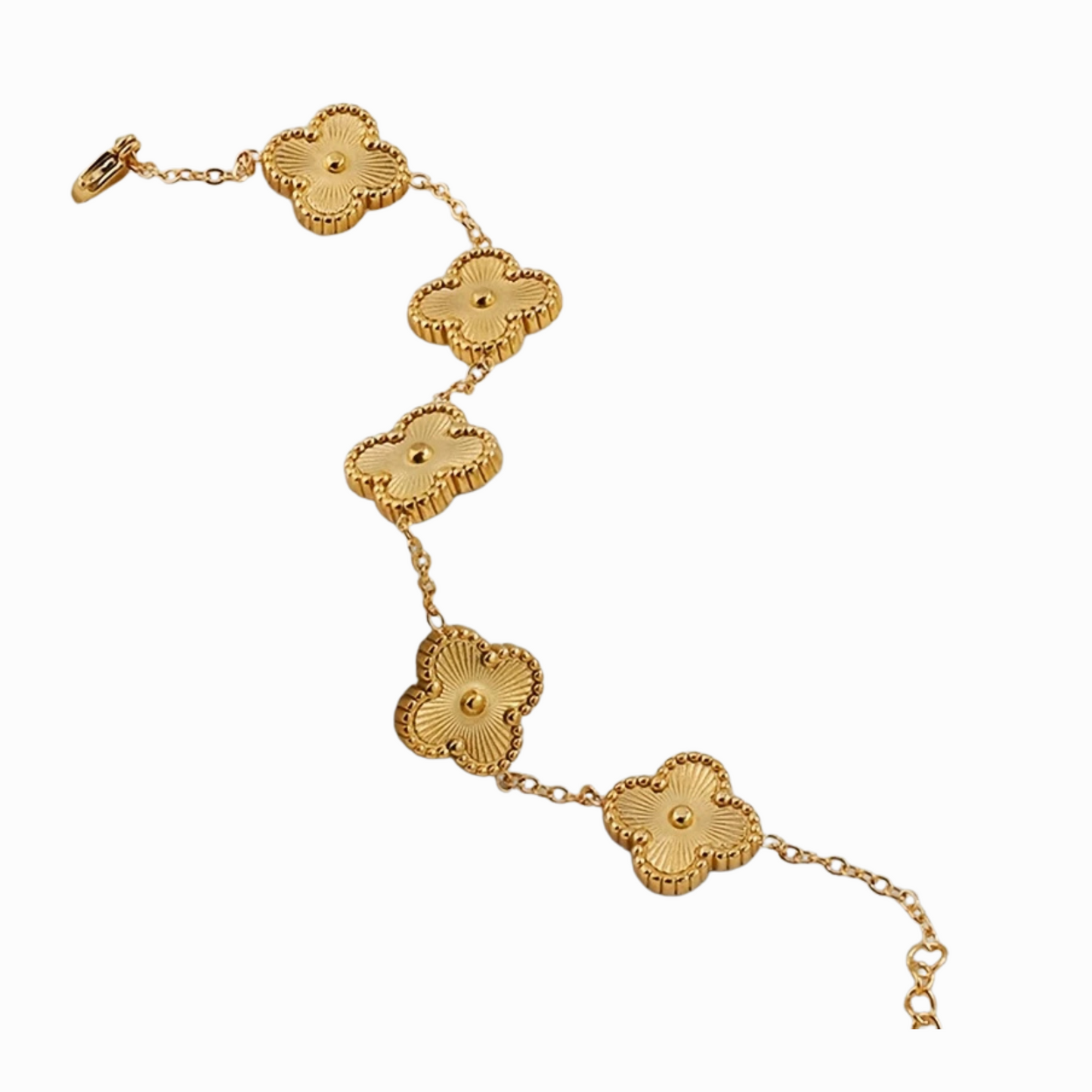 Gold bracelet with floral designs on a white background