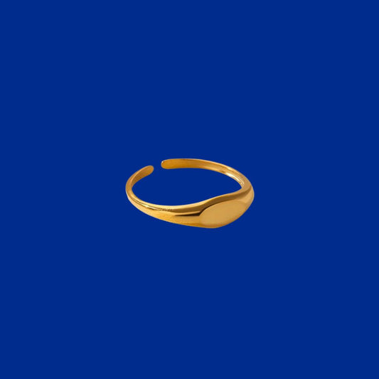 Gold ring on a blue background