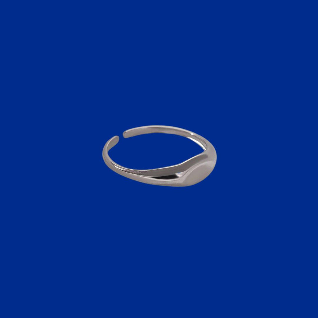 Silver ring on a blue background