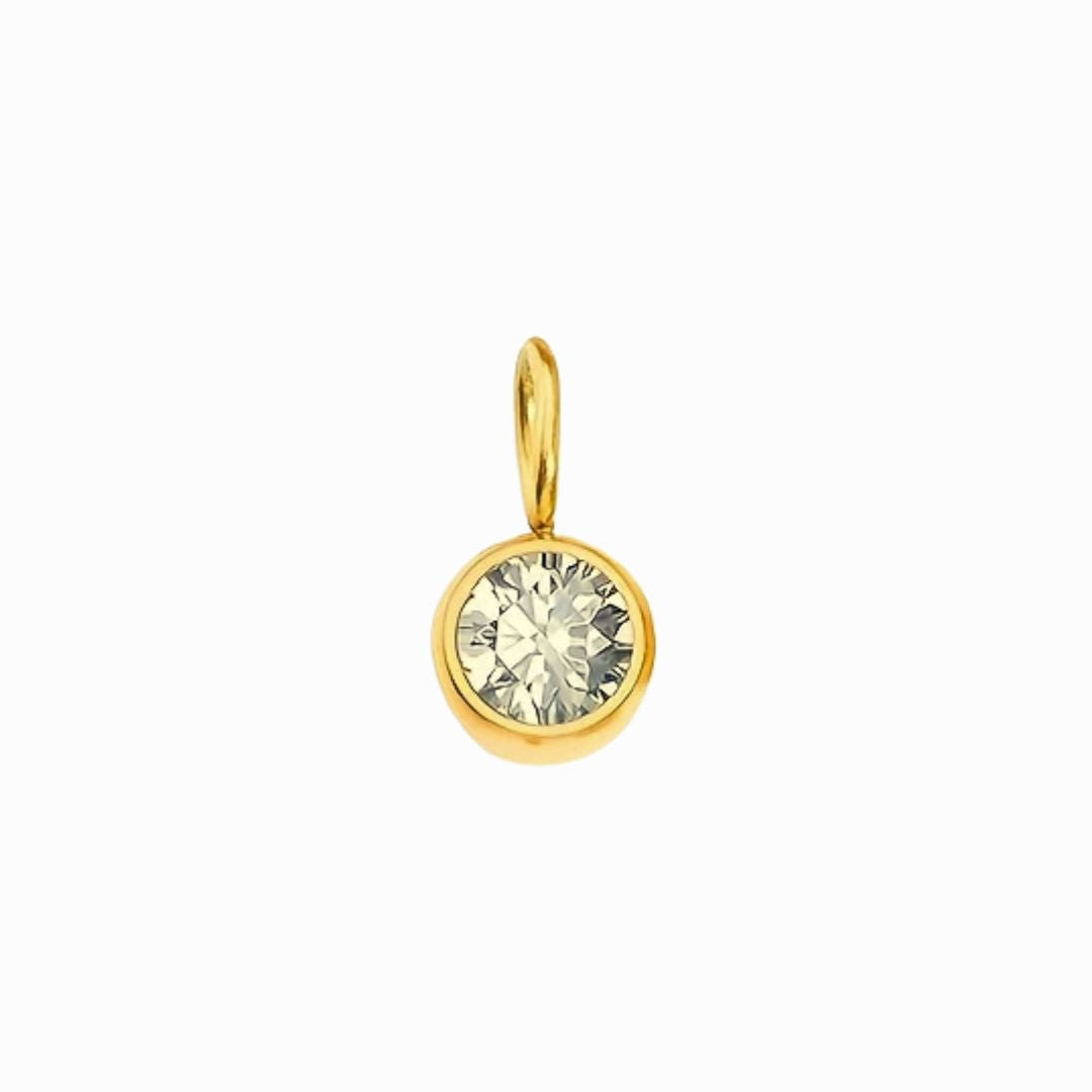 Gold pendant with a clear gemstone on a white background