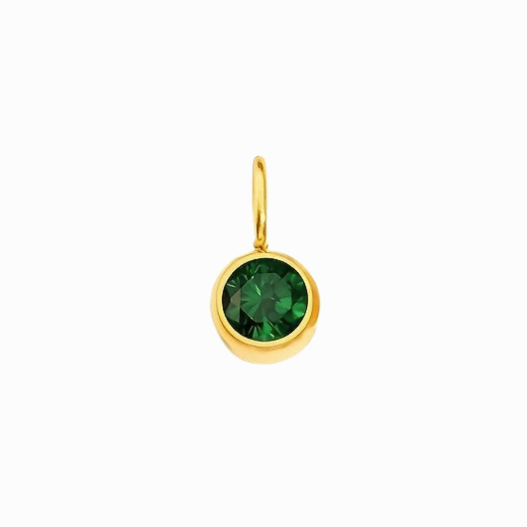 Gold pendant with a green gemstone on a white background
