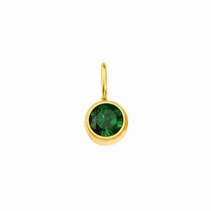 Gold pendant with a green gemstone on a white background