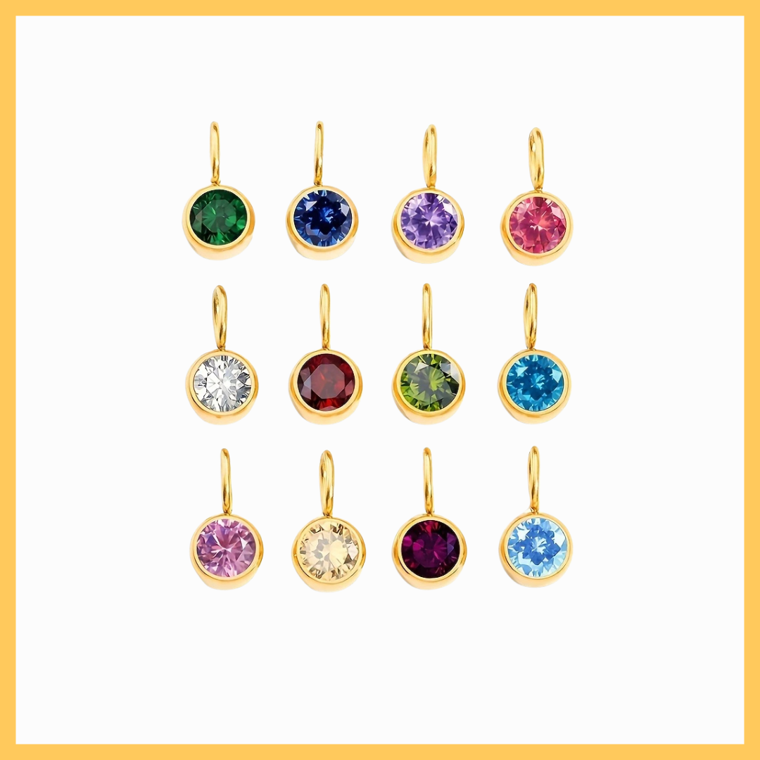 Set of gold earrings with colorful gemstones on a white background