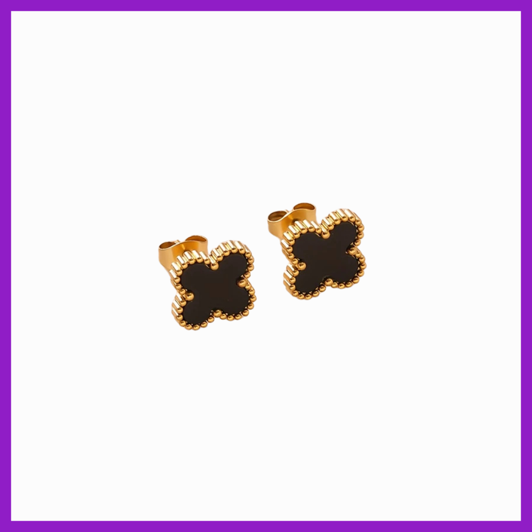 Butterfly-shaped earrings with gold and black design on a white background