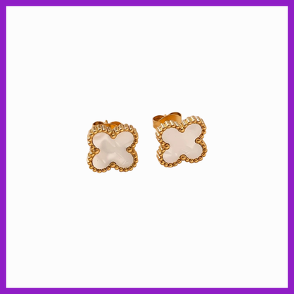 Pair of butterfly-shaped earrings with gold and beige design on a white background