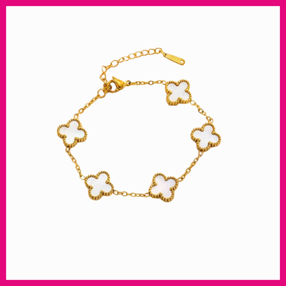 Gold bracelet with clover-shaped links on a white background