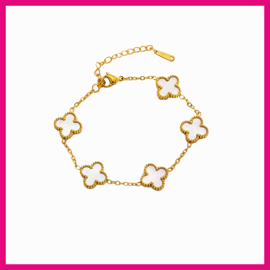 Gold bracelet with clover-shaped links on a white background