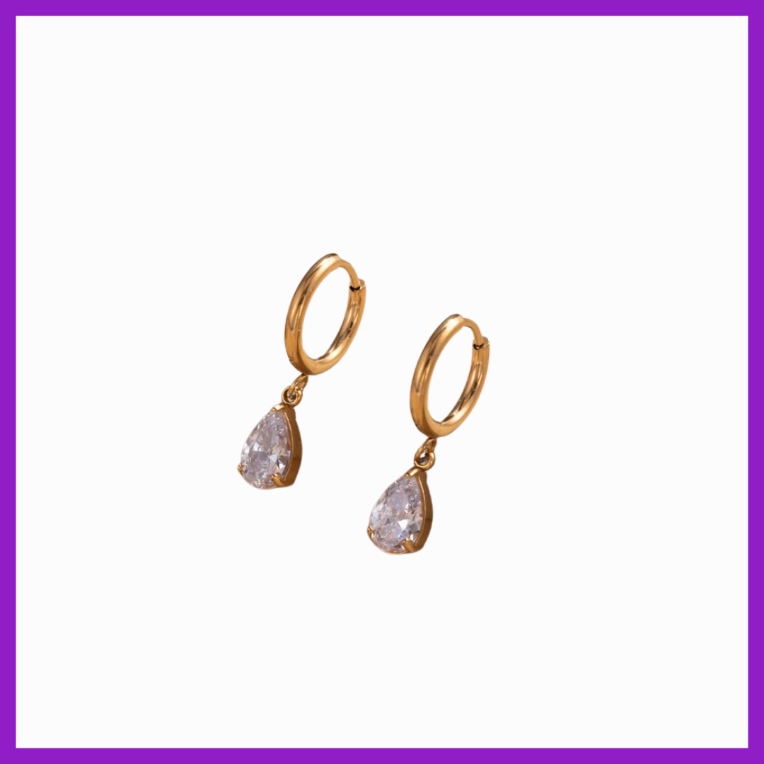 Gold hoop earrings with teardrop-shaped gemstones on a white background