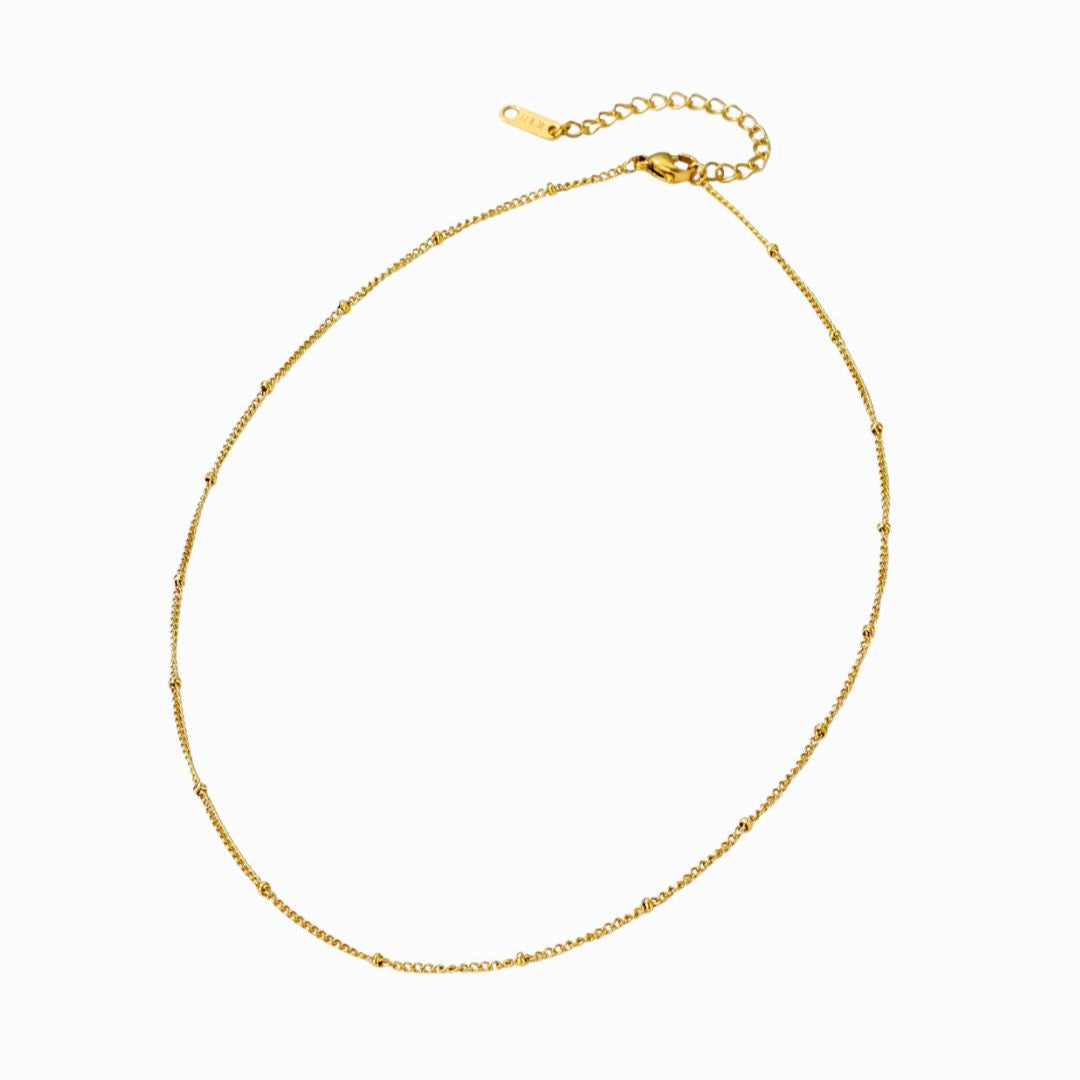 Gold necklace on a white background
