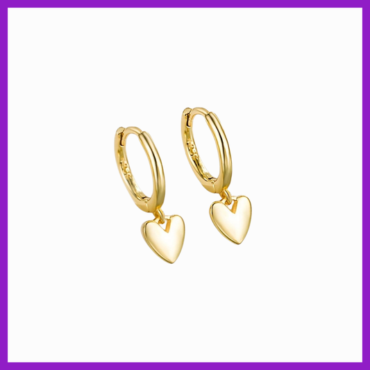 Gold heart-shaped hoop earrings on a white background