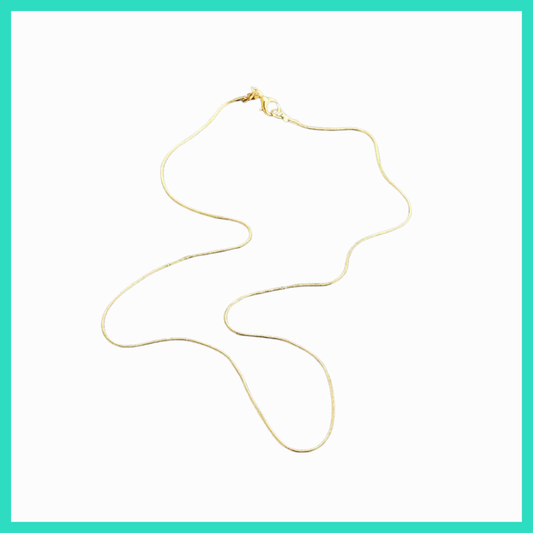 Gold necklace on a white background