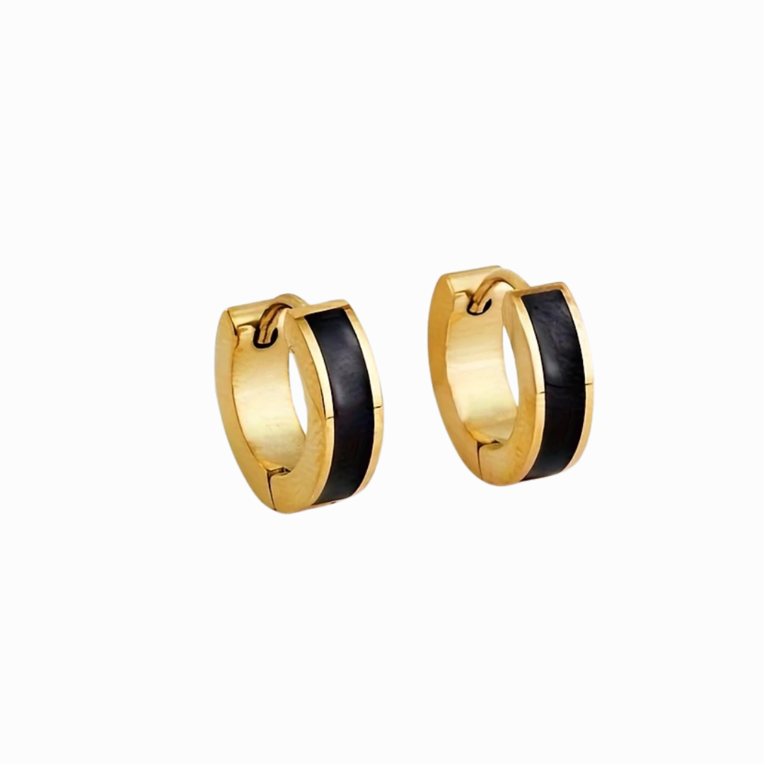 Gold hoop earrings with black enamel accents on a white background