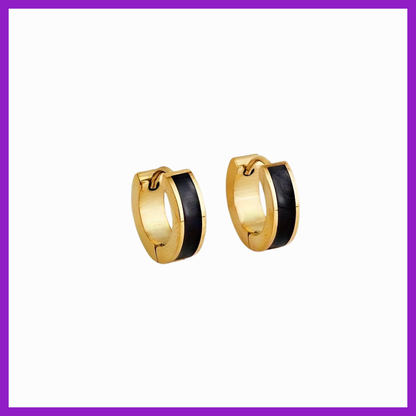 Gold hoop earrings with black interior on a white background