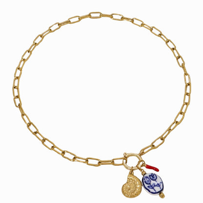 Gold chain bracelet with charms on a white background