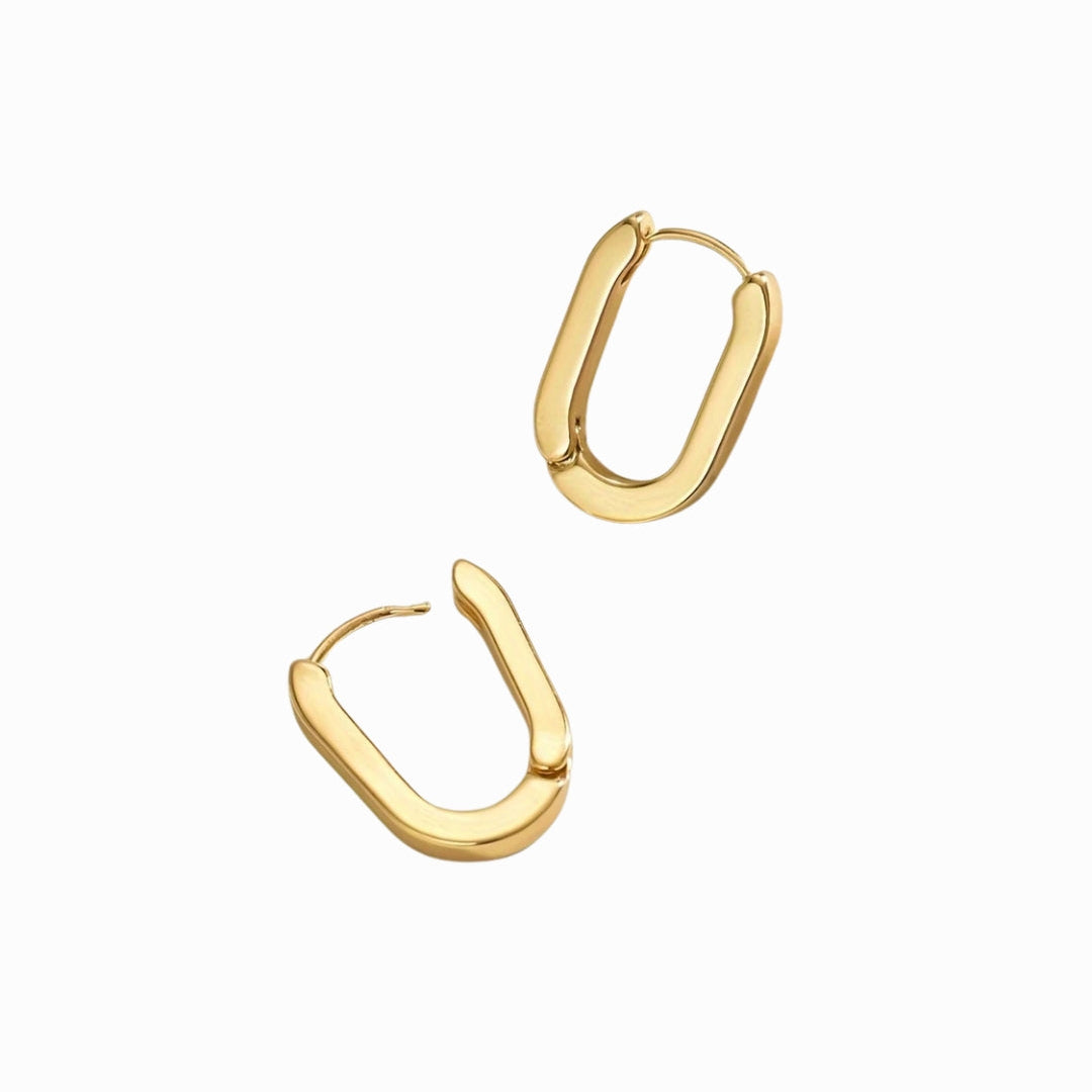 Gold hoop earrings on a white background