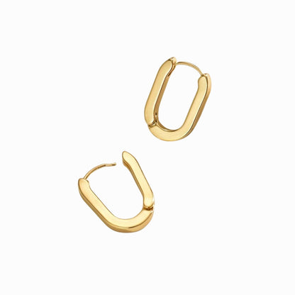 Gold hoop earrings on a white background