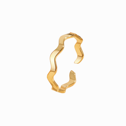 Gold open ring with wavy design on a white background