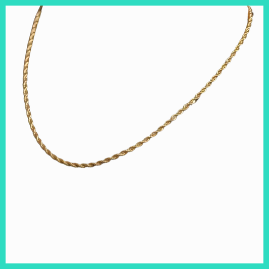 Gold chain necklace on a white background
